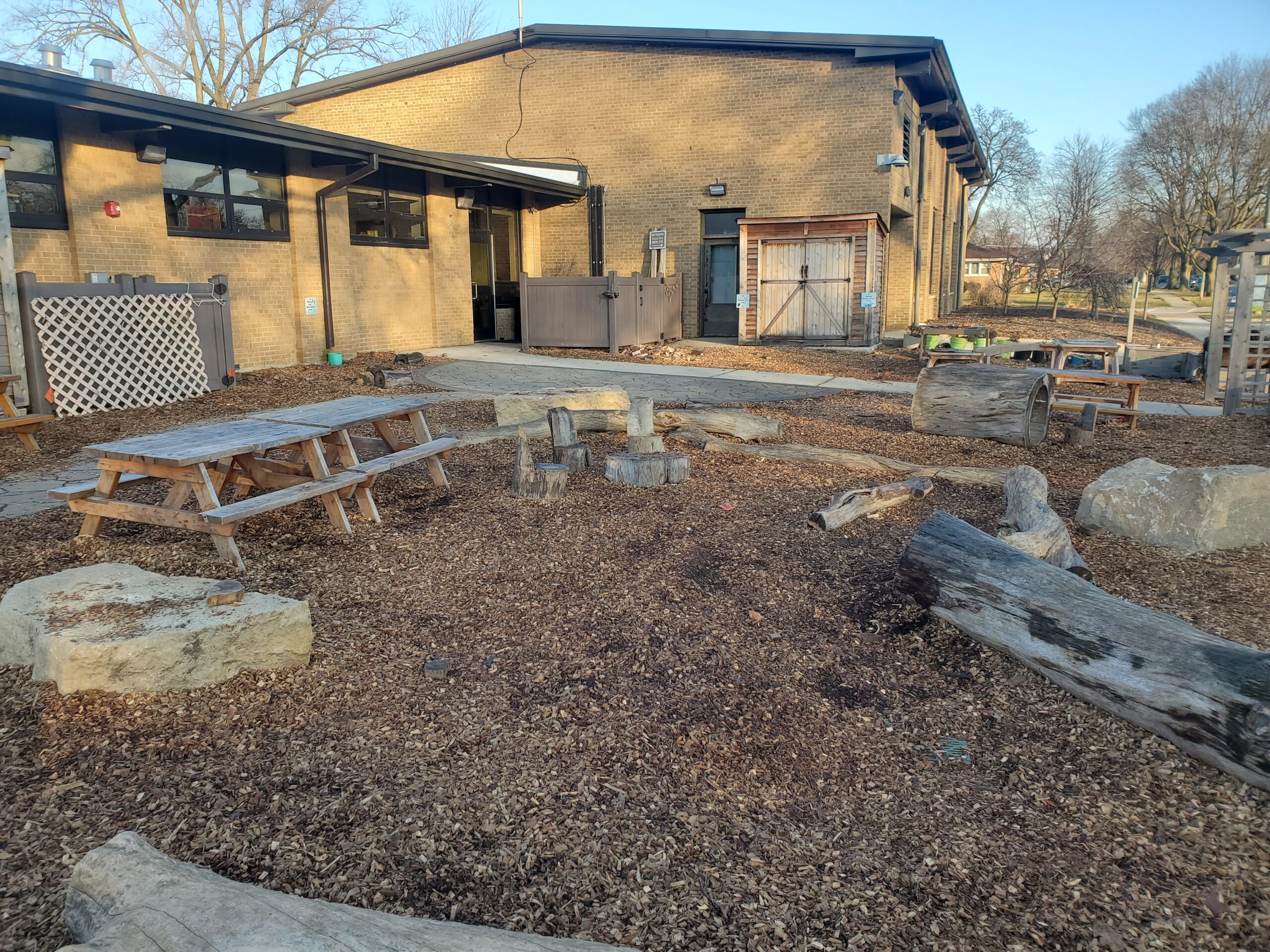 a view of the courtyard that faces the brick exterior of the Wildwood Nature Center