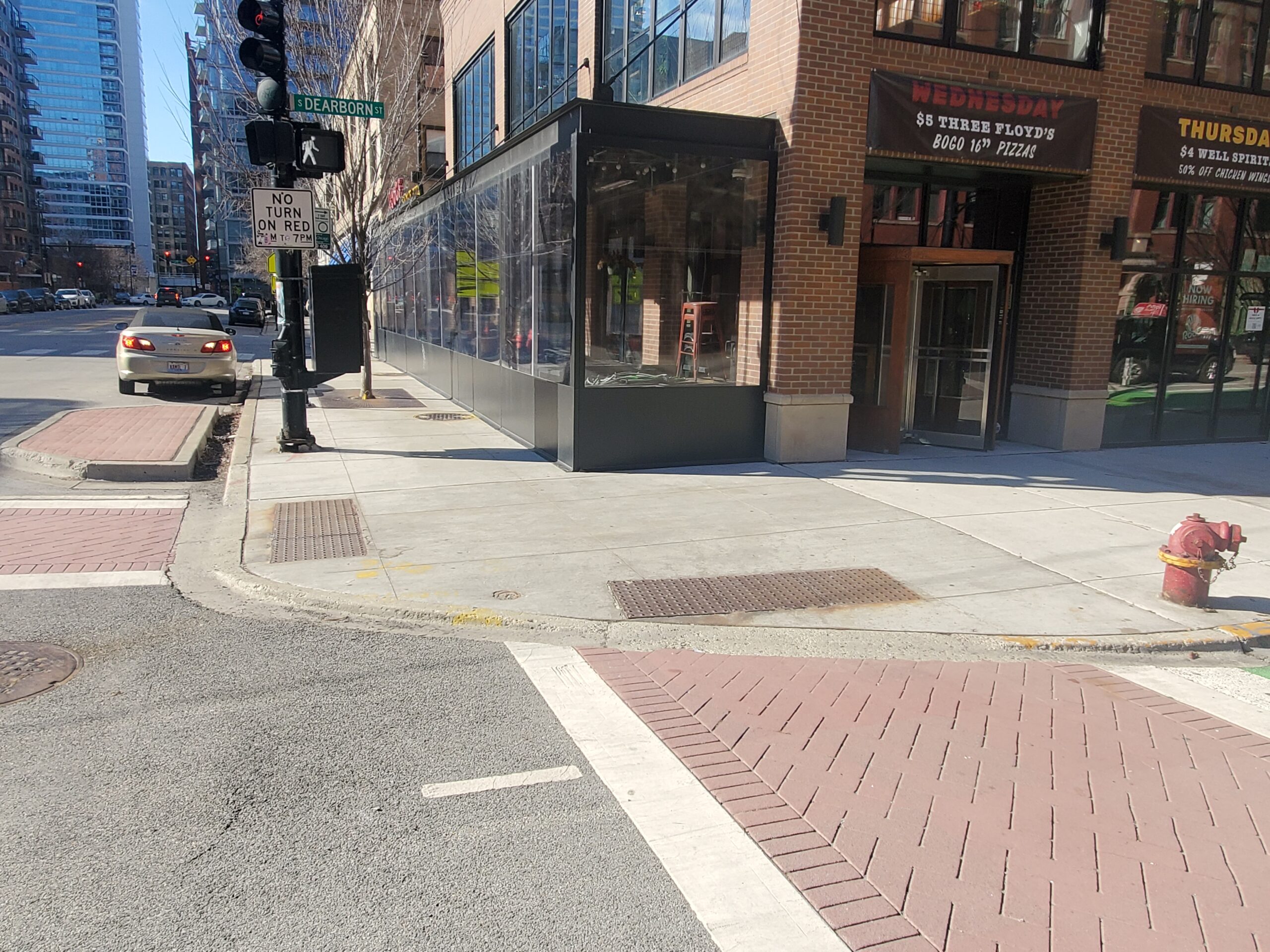 crosswalk and ADA accessible sidewalk in downtown urban area